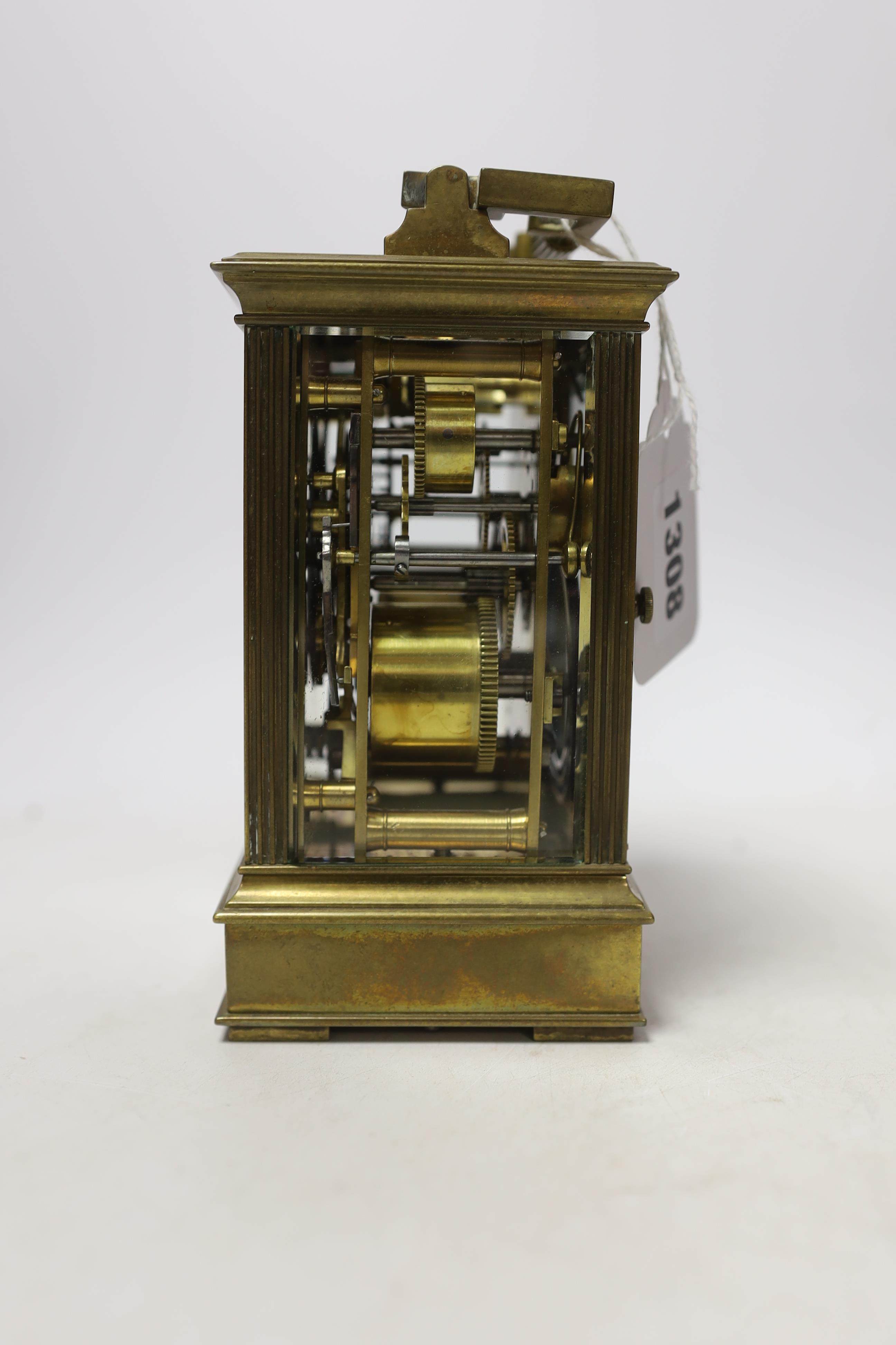 A cased early 20th century brass repeating carriage clock with alarm, 15.5cm